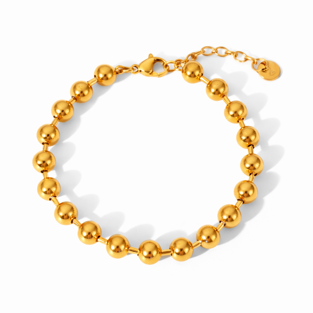 18K gold beaded bracelet on white background