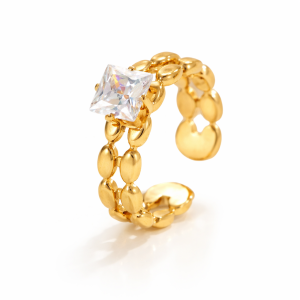 Gold chain link ring with princess cut cubic zirconia stone on a white background