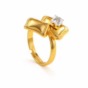 Gold bow ring with square crystal centerpiece on white background